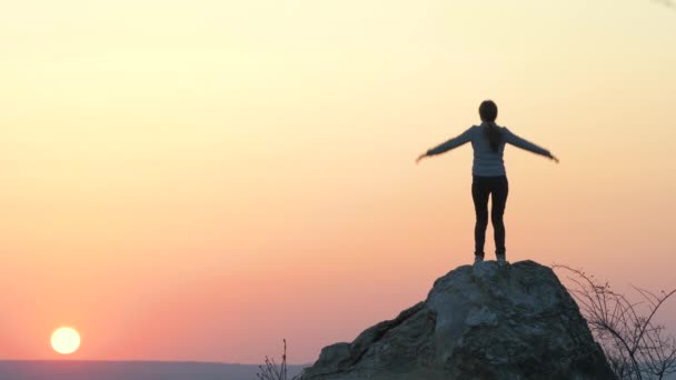 Silhouette Woman Hiker Jumping Alone Big Stone Sunset Mountains Female — Stock Video