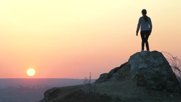 Silhouette Woman Hiker Jumping Alone Big Stone Sunset Mountains Female — Stock Video