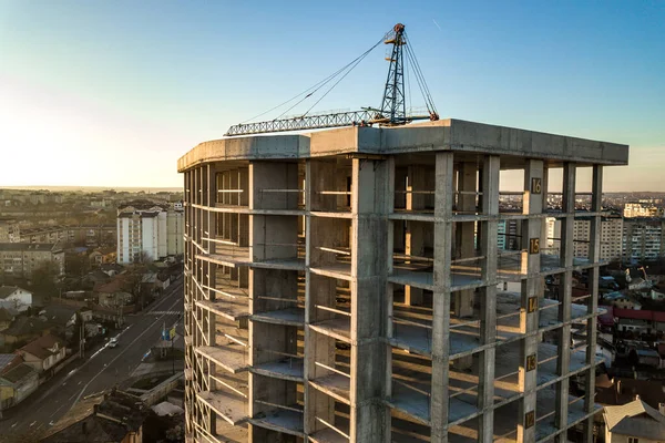 Aerial view of concrete frame of tall apartment building under construction in a city. — Stock Image Aerial View Concrete Frame Tall Apartment Building Construction City Royalty Free Stock Images