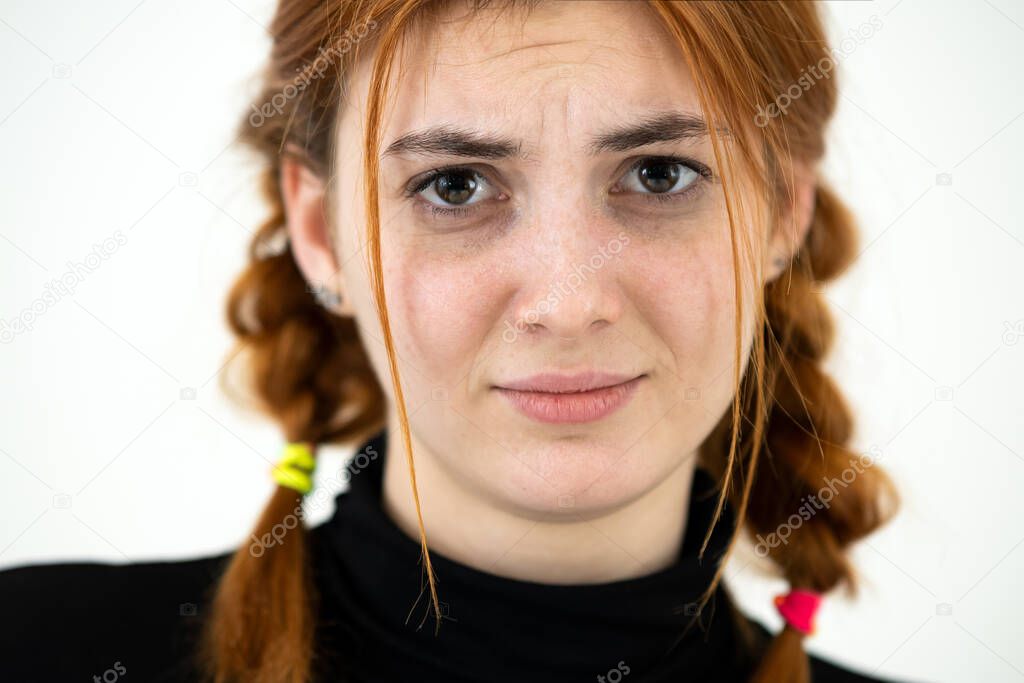 Close up portrait of innocent looking redhead pretty teenage girl.