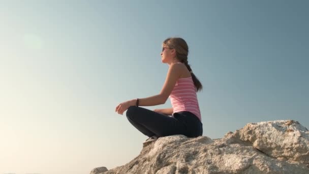 Young Relaxed Woman Sitting Outdoors Big Stone Enjoying Warm Summer — Stock Video