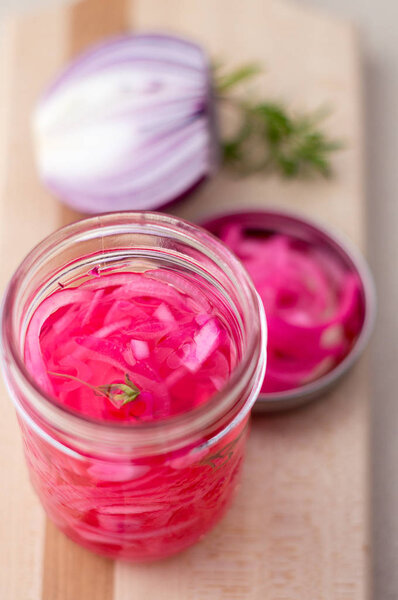 Pickled red onions condiment.