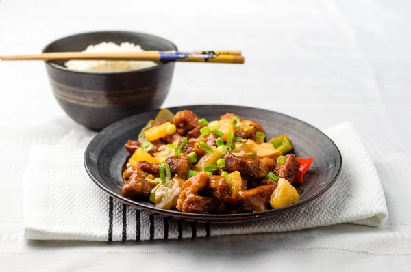 Sweet and sour pork with rice bowl.
