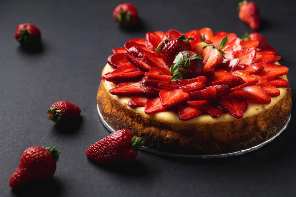 Whole strawberry cheese cake dessert closeup.
