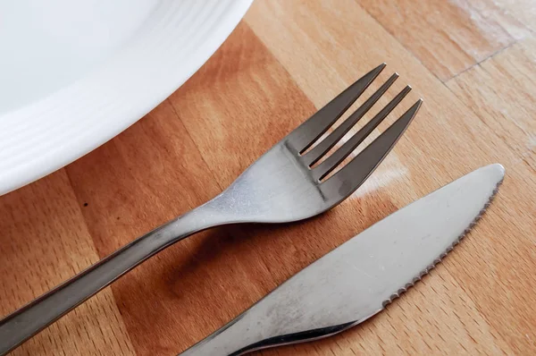 A plate, knife and fork — Stock Photo, Image