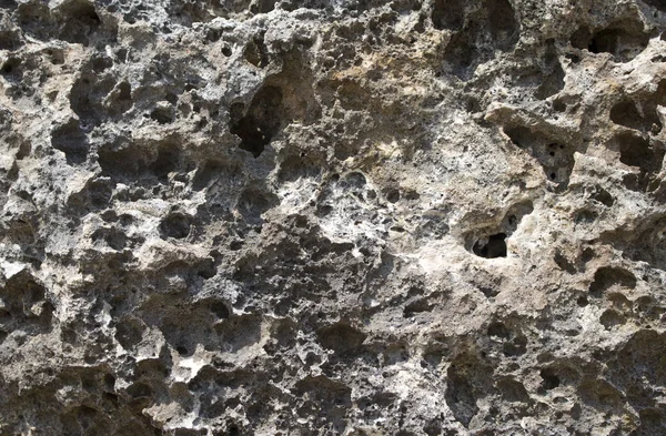 Сірий натуральний камінь текстури фону фотографії. Вулканічна кам'яна текстура. Скелясте узбережжя . — стокове фото