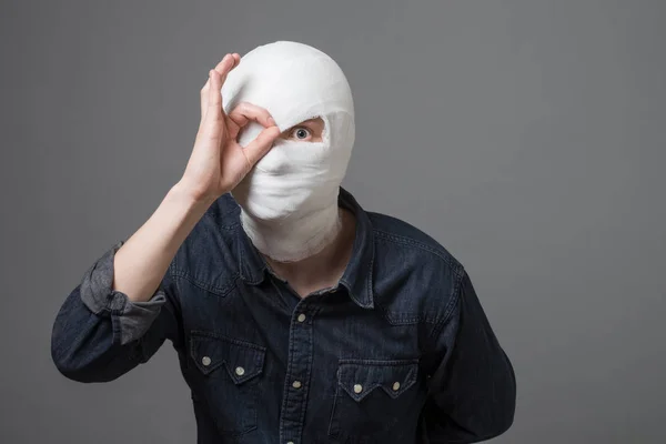 Man with bandage on his head