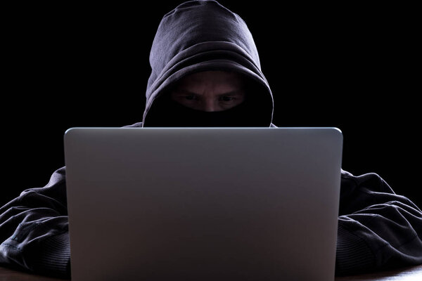 Anonymous hacker in the dark