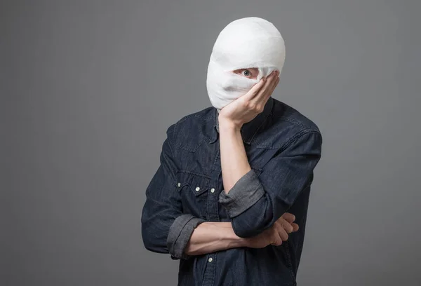 Man with bandage on his head