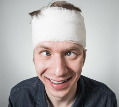 Man with bandage on his head clipart