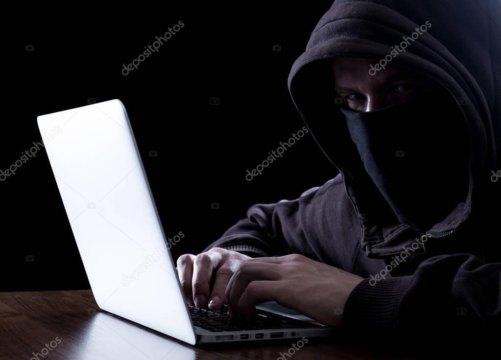 Anonymous hacker in the dark