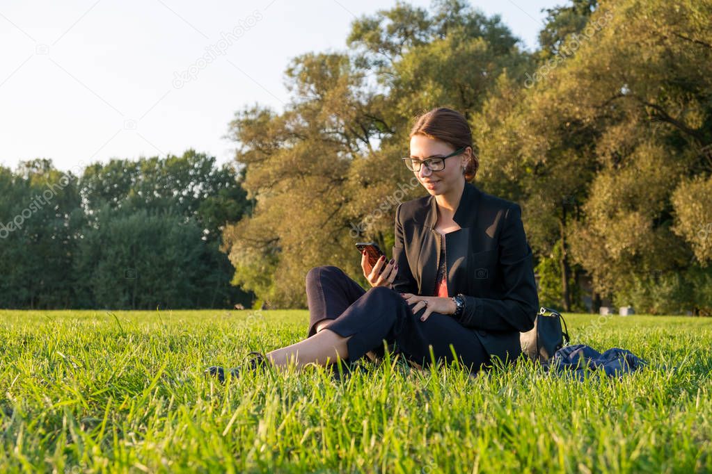 Businesswoman on grass
