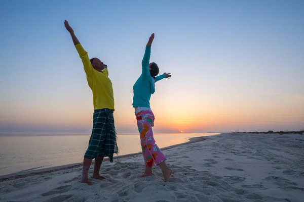 Joyful couple, with open arms