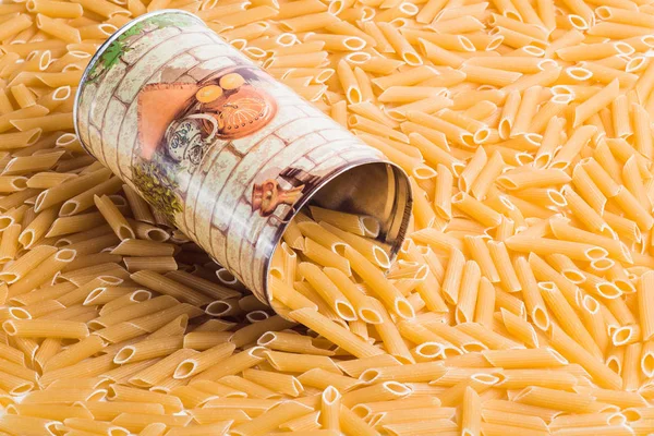 Cylindrical pasta spilled from the metal cans — Stock Photo, Image