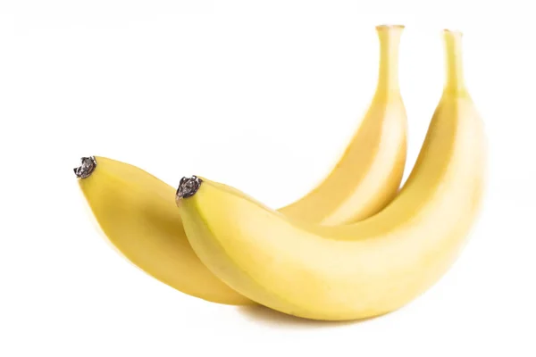 Купа бананів на білому тлі — стокове фото