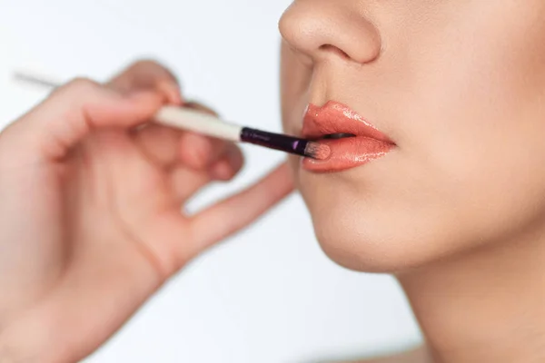 Makeup Artist Paints Lips Client Woman Lipstick Brush Isolated White — Stock Photo, Image