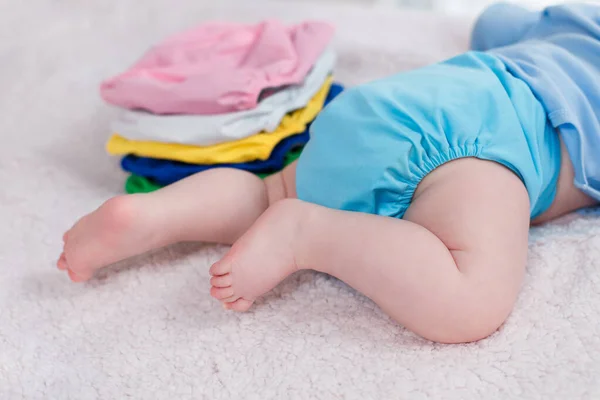 Child Lies Stack Multi Colored Reusable Diapers Changing Table — Stock Photo, Image
