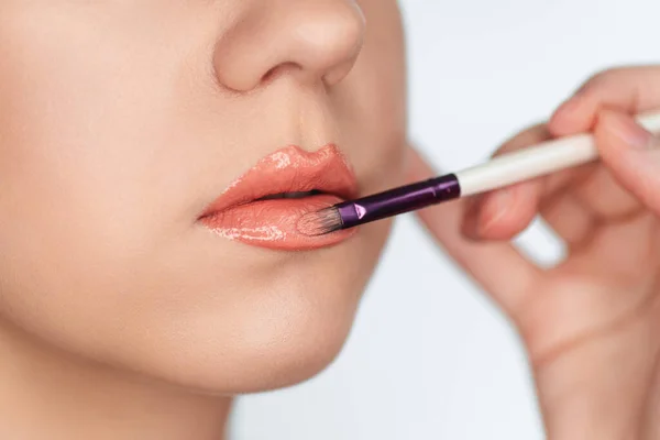 Makeup Artist Paints Lips Client Woman Lipstick Brush Isolated White — Stock Photo, Image