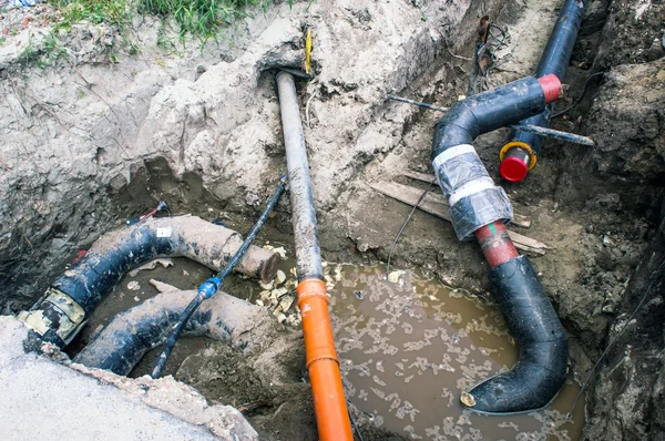 Several Pipes in the Earthen Trench  for Heating System — Stock Photo, Image