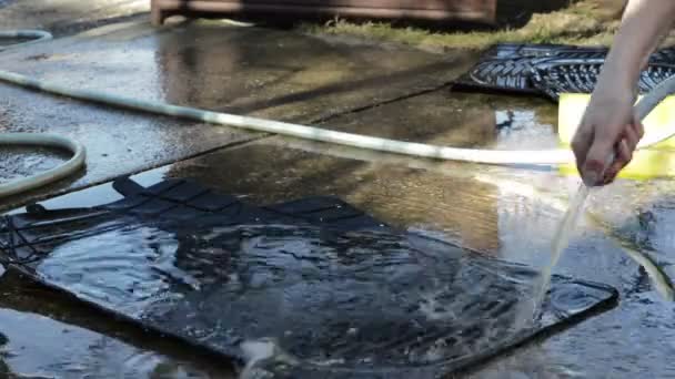 Cleaning Of Car Floor Mats With Hose High Pressure Cleaner Stock