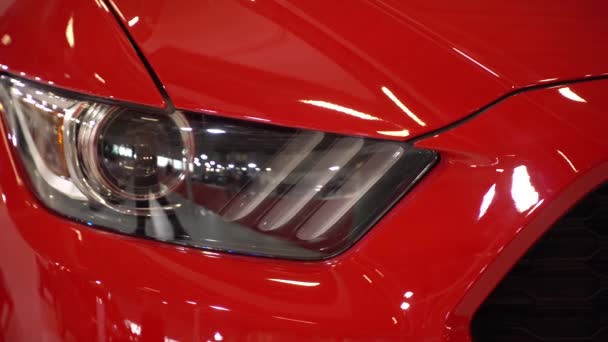 A head-on, close up shot of a car's headlight. — Stock Video