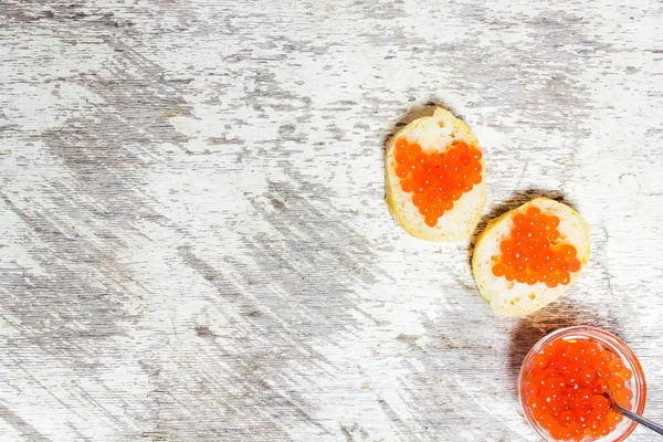 Sandwiches with heart shaped red caviar — Stock Photo, Image