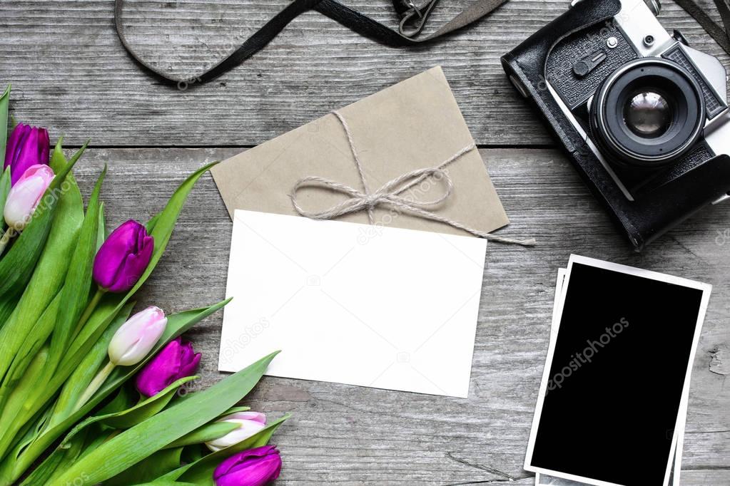 blank greeting card and envelope with retro camera, blank photos