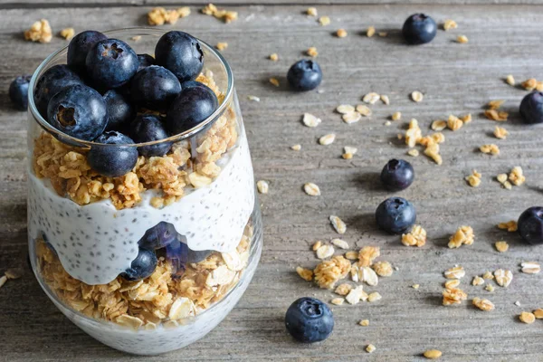 glass of blueberry yogurt parfait or chia pudding