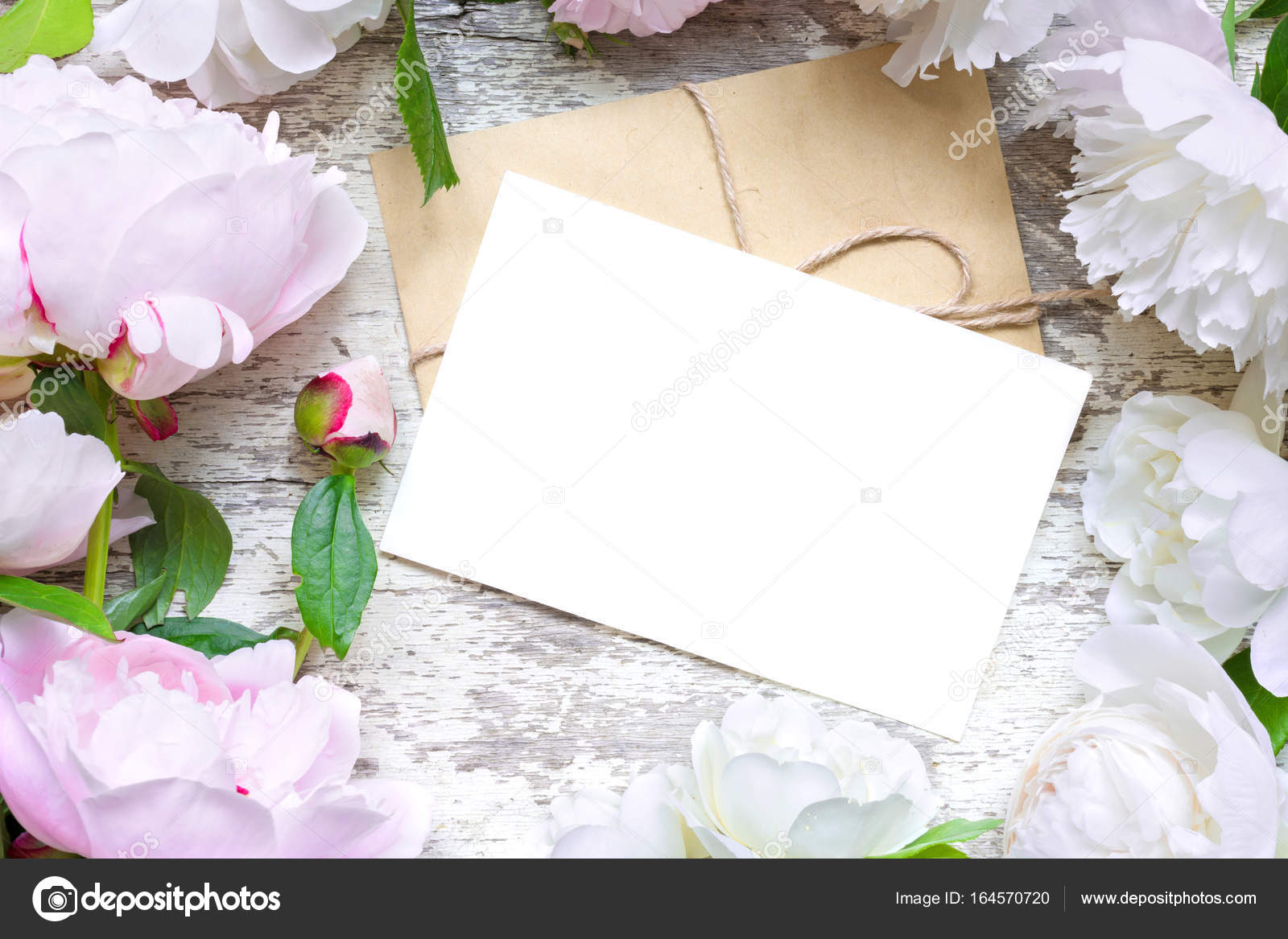 Blank Greeting Card And Envelope In Frame Of Pink White Peonies Blank Greeting Card And Envelope In Frame Of Pink White Peonies Roses Over Wooden Background Flat Lay Top View With Copy Space Wedding
