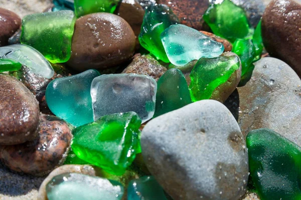 Glass beach. Natural texture with polished sea glass, stones and sand. baltic sea — Stock Photo, Image