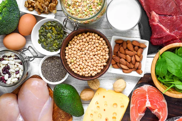 Selection of protein food sources. Meat, fish, vegetables, dairy, beans, nuts and seeds for healthy balance diet — Stock Photo, Image