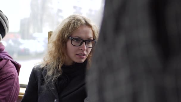 Portrait of a happy woman during a tram holding a conversation — Stock Video