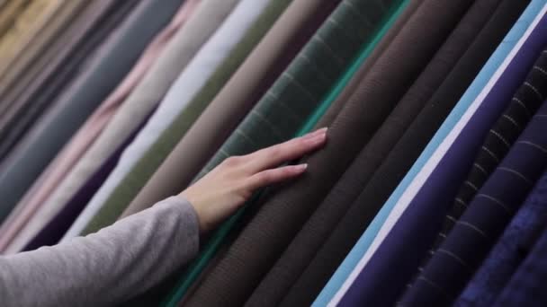 Hands touch the fabric in a textile shop — Stock Video