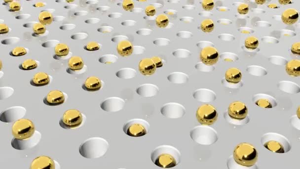 Bolas douradas sobem e caem para cima e para baixo em buracos em uma superfície branca — Vídeo de Stock