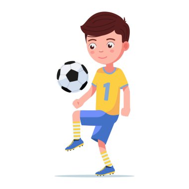 Futbolcu çocuk topa vuruyor.
