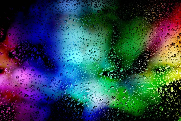 Fondo abstracto: luces brillantes y gotas de lluvia en el vidrio. N —  Fotos de Stock