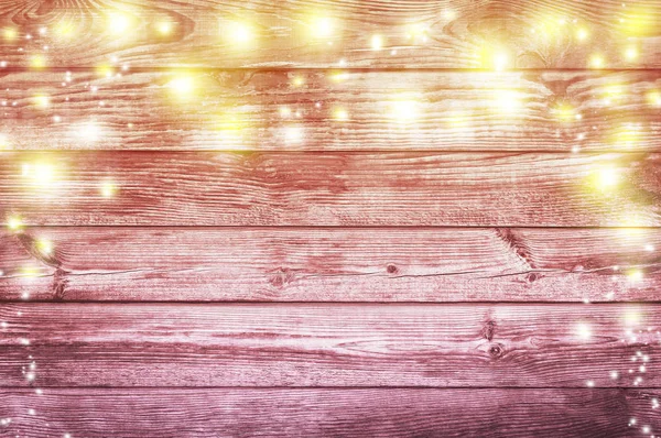 Weihnachtsbeleuchtung auf altem Holzgrund. Weihnachtlicher Background — Stockfoto