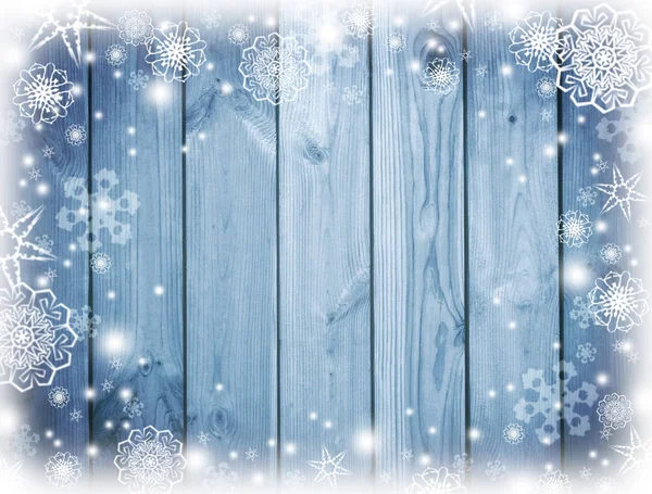Синій дерев'яний фон зі снігом. Мороз, сніжинки на дошках . — стокове фото
