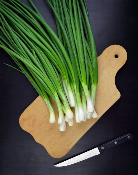 Green onions. Food background. Useful products in a rural settin — Stock Photo, Image