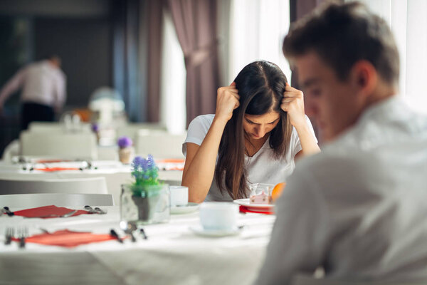 Furious woman having emotional problems.Relationship issues.Breaking up, divorce, having hurtful conversation.Confession, telling truth.Questioning yourself.Headache.Conflict with boyfriend / husband
