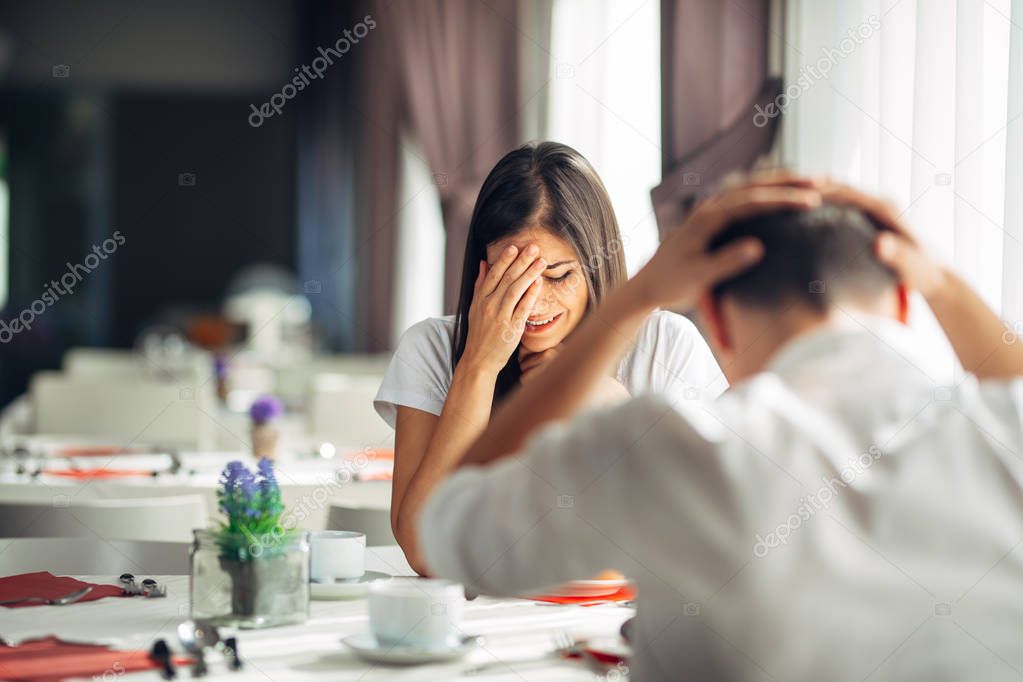 Crying stressed woman arguing with a man about problems.Reaction to negative event,handling bad news.Breaking up long relationship.Emotional troubled woman expression.Couple fighting.Emotional pain