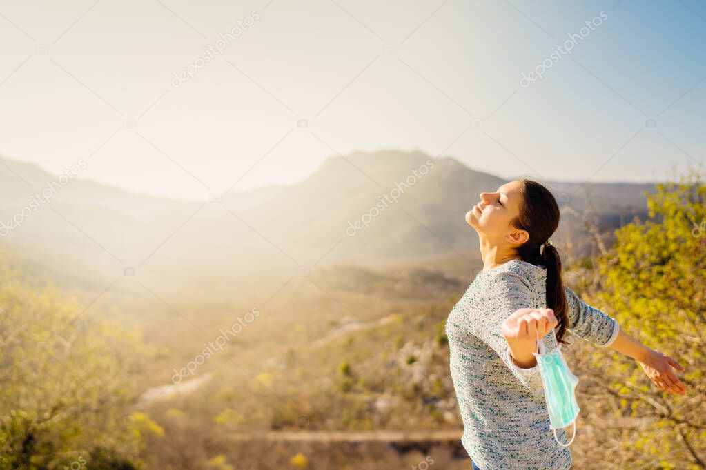 Woman celebrating without mask.Concept of defeating illness.Recovered from coronavirus.Cured disease emotional patient.Covid-19 virus outbreak problems solved.Immunity to virus.Stress free.Breathing