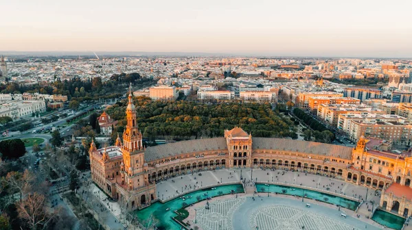 Sunset on Spain Square.Landmark square with a large water feature and ornate pavilionAerial view of Plaza de Espana famous decoration with ceramic tiles, Seville (Sevilla), Andalusia, Spain.