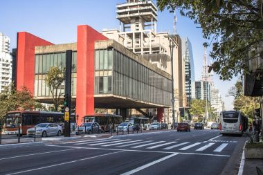 Traffic jam and facade of The Sao Paulo Museum of Art (in Portuguese, Museu de Arte de Sao Paulo, or MASP) on Paulista Avenue, central region of Sao Paulo,  clipart