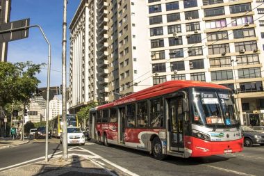Electric bus travels through Joao Mendes Square, downtown Sao Paulo, SP clipart
