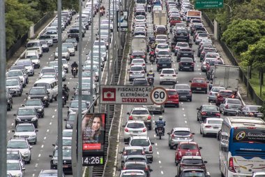 Sao Paulo, Brazil, October 23, 2017. Heavy traffic in the North South Corridor, at the Rubem Berta Avenue, south zone of Sao Paulo. This avenue connects the northern and southern areas of the city. clipart