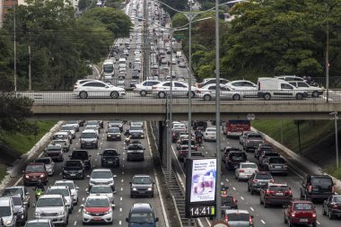 Heavy traffic in the North South Corridor, at the Rubem Berta Avenue, south zone of Sao Paulo. This avenue connects the northern and southern areas of the city. clipart