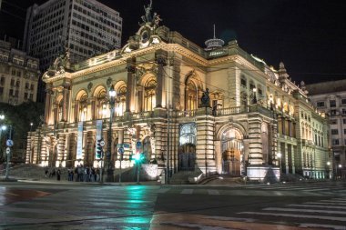 Sao Paulo, Brazil - April 20, 2017: Municipal theater of Sao Paulo at night. Built in 1903 and opened in 1911, with the opera Hamlet, of Ambrose Thomas, clipart