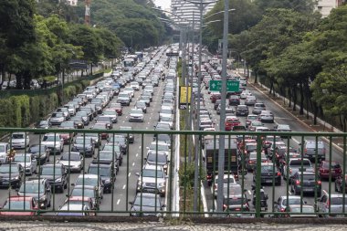 Sao Paulo, Brazil, December 08, 2017. Heavy traffic in the North South Corridor, at the 23 de Maio Avenue, south zone of Sao Paulo. This avenue connects the northern and southern areas of the city. clipart