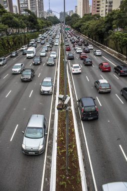 Sao Paulo, Brazil, December 08, 2017. Heavy traffic in the North South Corridor, at the 23 de Maio Avenue, south zone of Sao Paulo. This avenue connects the northern and southern areas of the city. clipart